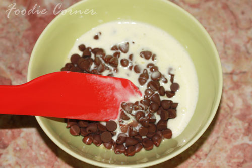 pour melted cream over chocolate